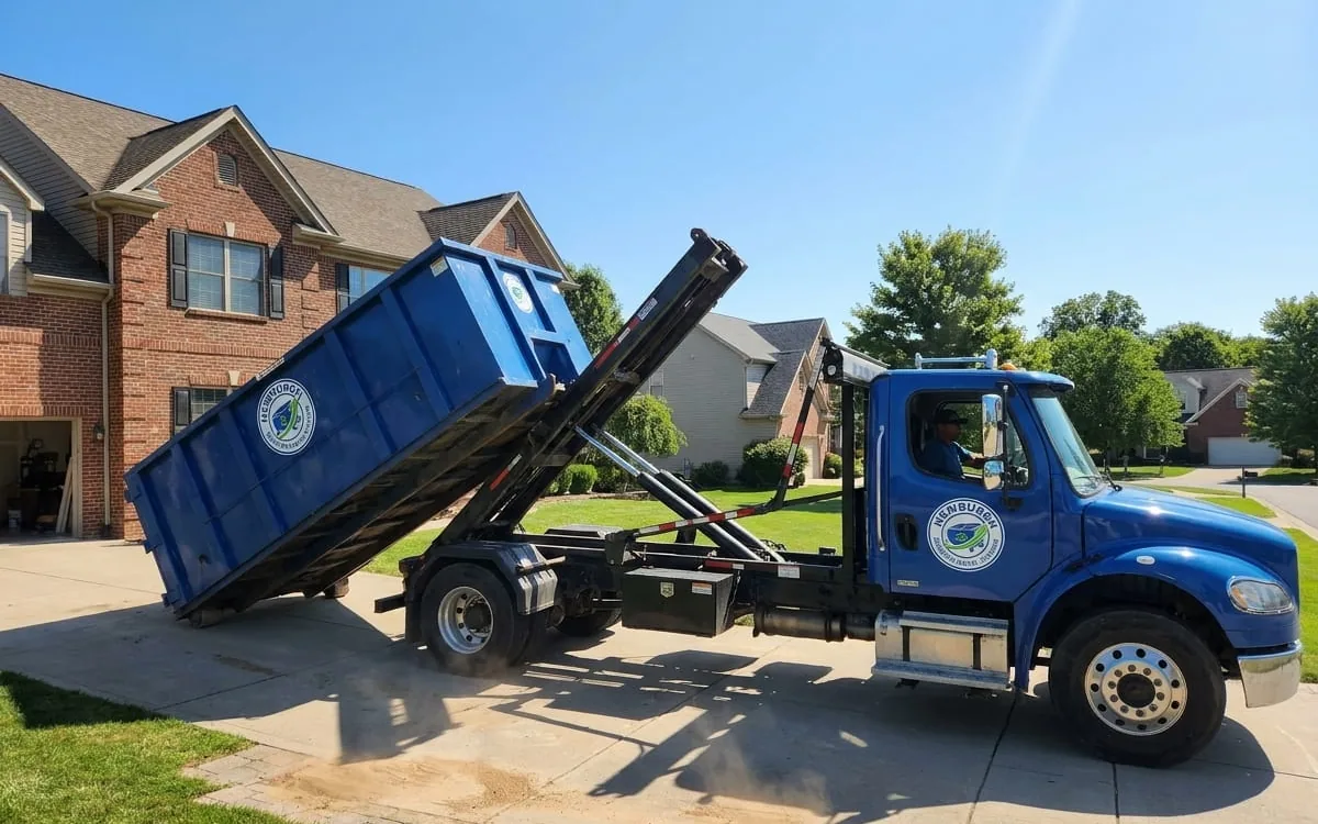 Where Your Debris Actually Goes in Orange County, NY Dumpster truck collecting a loaded roll-off in Orange County NY